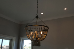 Dining room light fixture with wood beads