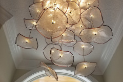Foyer light fixture with dozens of glass pieces assembled and installed by DB Electrical
