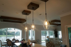Wood ceiling trays with LED tape lighting and custom pendant lights