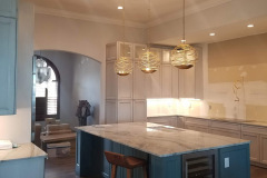Kitchen renovation in Daytona Beach including sun tunnels, 4-inch cans, under-cabinet lighting, hidden outlets and pendant lights