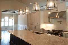 Pendant lights, under-cabinet lighting and 4-inch LED cans in a new kitchen